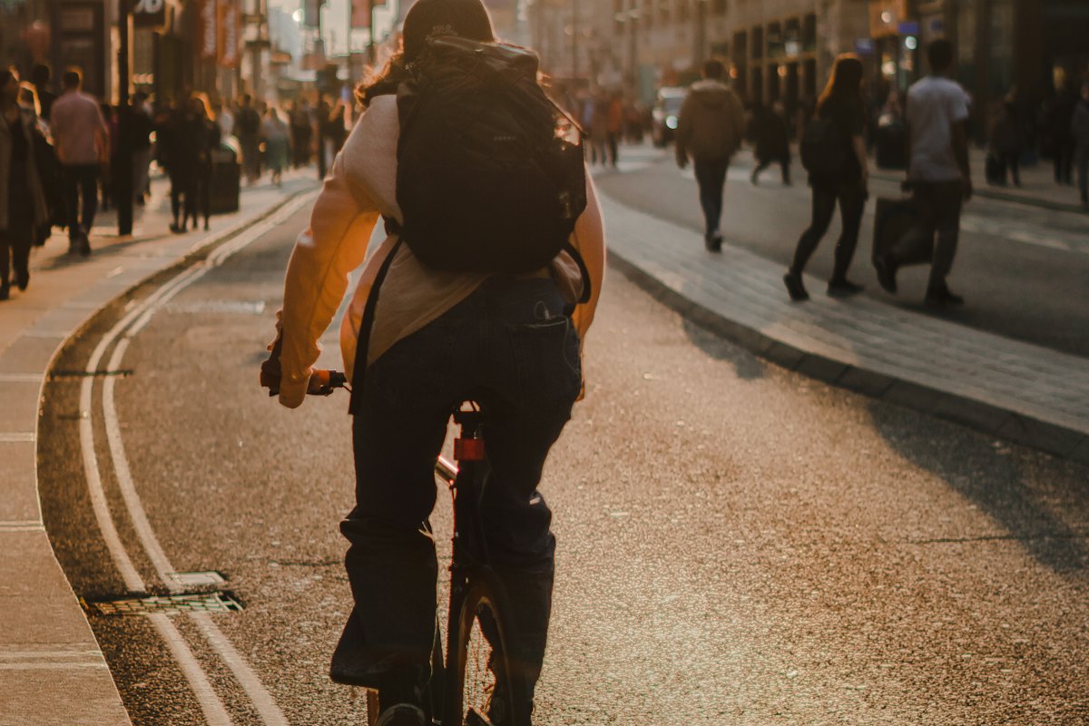 A courier cycling through the city